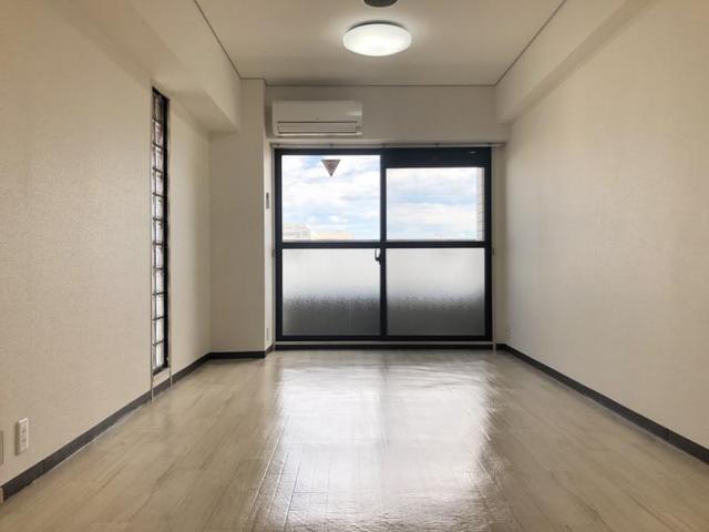 ロイヤルハイツつかしんの居間写真